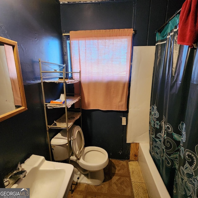 full bathroom with sink, toilet, shower / bath combo, and parquet flooring