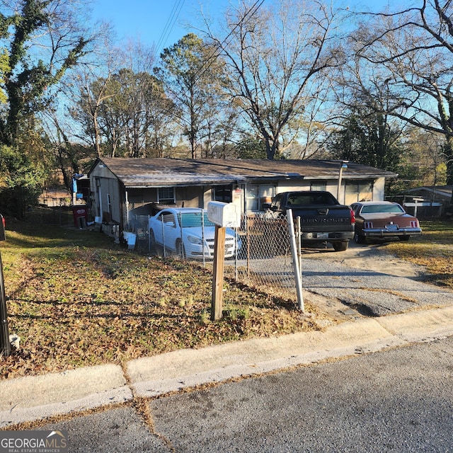 view of front of house featuring a carport