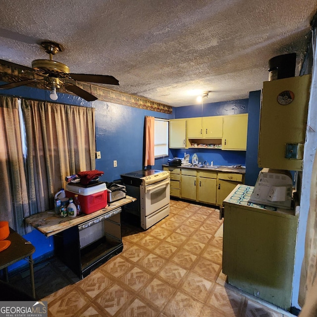 kitchen featuring ceiling fan, a textured ceiling, and white electric range