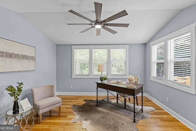 office area with ceiling fan, vaulted ceiling, and light hardwood / wood-style floors