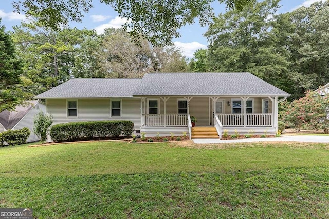 single story home with a porch, roof with shingles, and a front yard