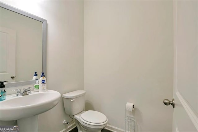 bathroom with sink and toilet