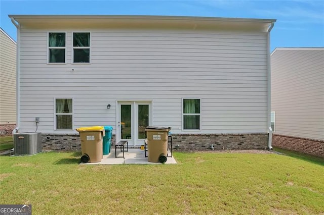 back of house featuring a patio area, central AC unit, and a yard