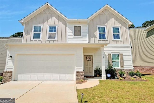 view of front of house with a garage and a front lawn