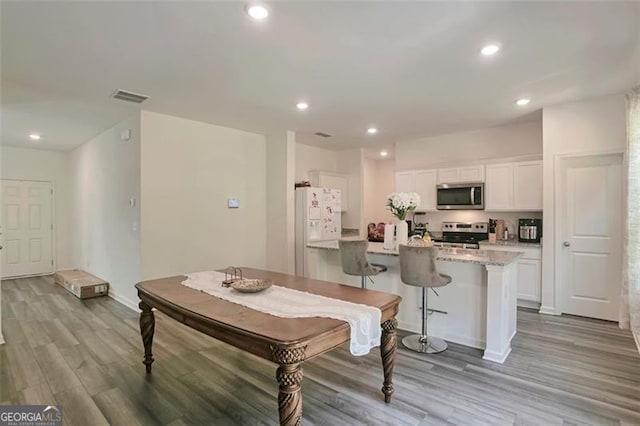 dining room with light hardwood / wood-style floors