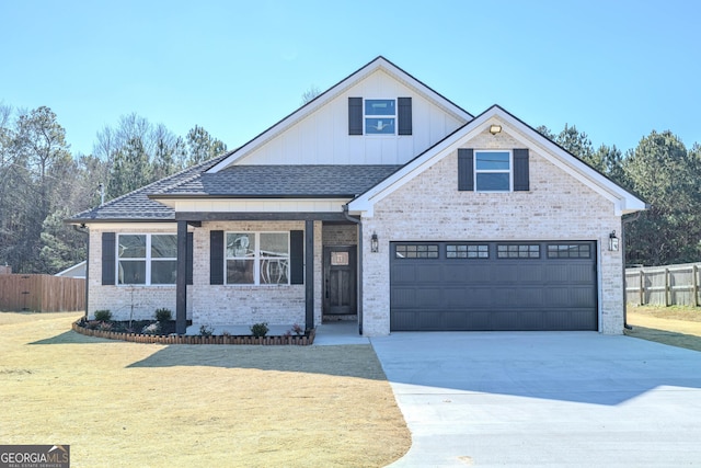 view of front of house with a garage and a front lawn