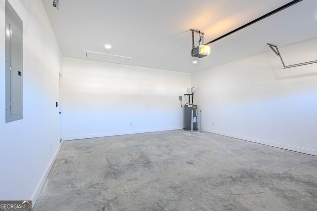 garage featuring a garage door opener, electric panel, and water heater