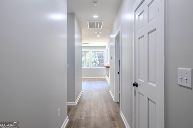 hallway featuring hardwood / wood-style flooring