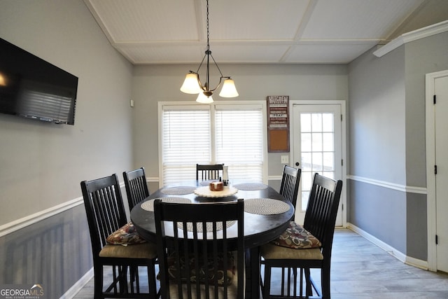 dining room featuring a notable chandelier and light wood-type flooring