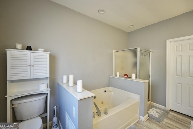 bathroom featuring separate shower and tub, hardwood / wood-style floors, and toilet