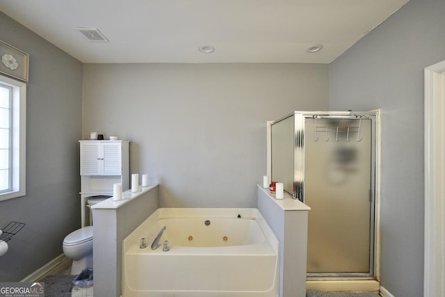 bathroom with a healthy amount of sunlight, toilet, and shower with separate bathtub