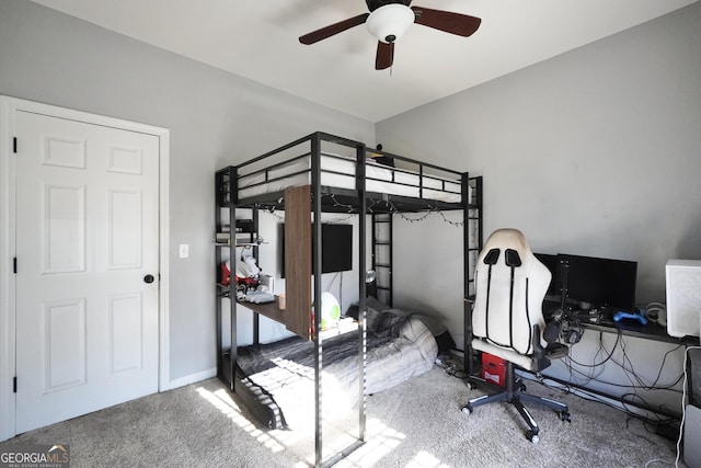 bedroom with ceiling fan and carpet