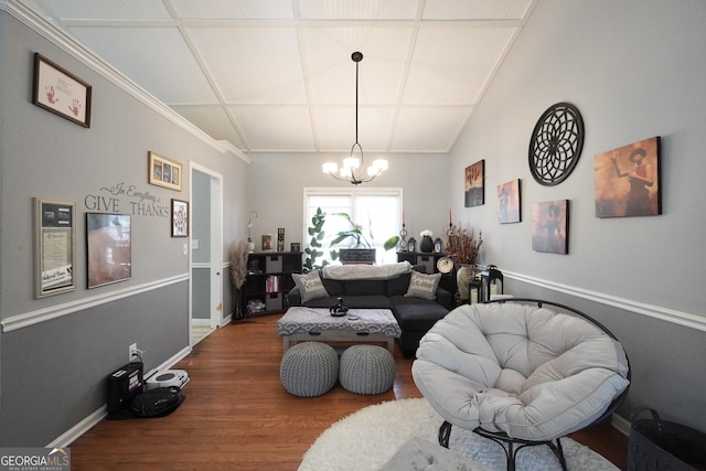 interior space featuring hardwood / wood-style flooring, lofted ceiling, and a notable chandelier