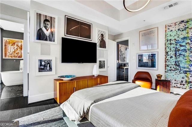 bedroom featuring dark hardwood / wood-style flooring