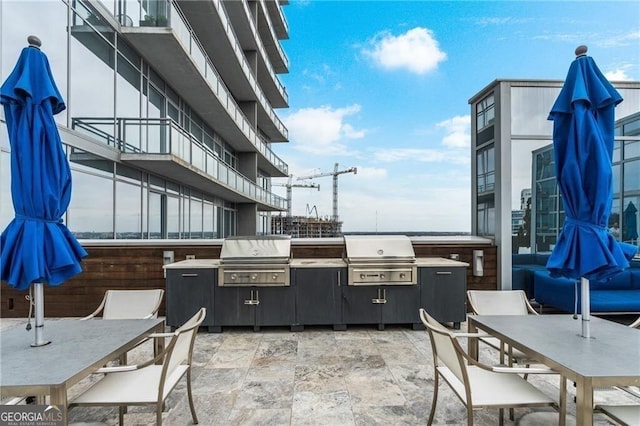 view of patio featuring area for grilling and outdoor dining area