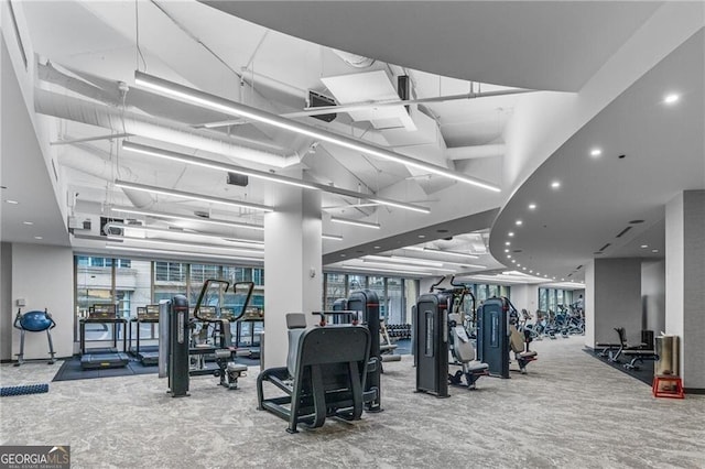 exercise room featuring carpet flooring and recessed lighting