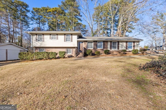 tri-level home featuring a front lawn