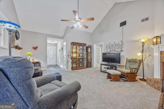 living room with carpet flooring, high vaulted ceiling, and ceiling fan