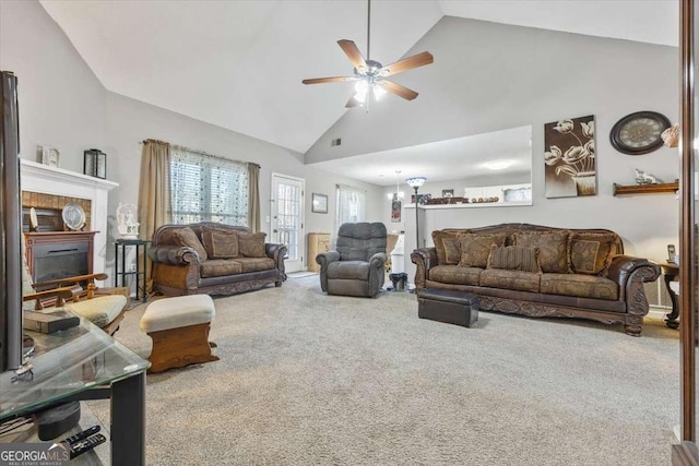 living room with carpet floors, high vaulted ceiling, and ceiling fan