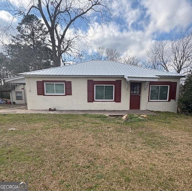 ranch-style home with a front yard