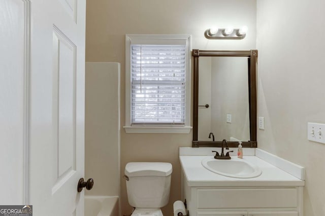 bathroom featuring toilet and vanity