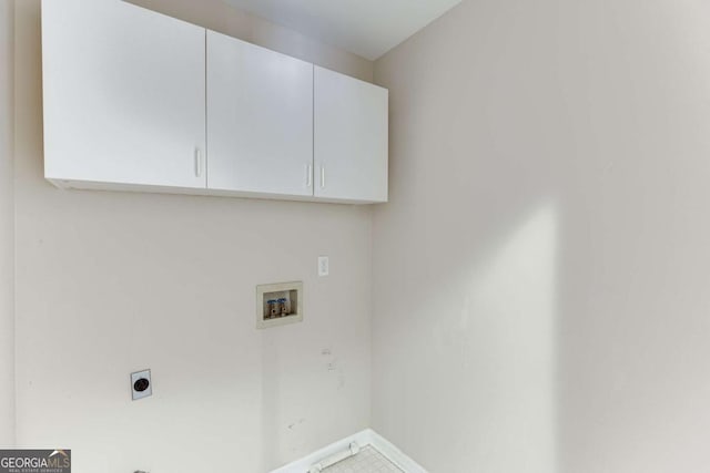 laundry room featuring hookup for an electric dryer, cabinets, and washer hookup