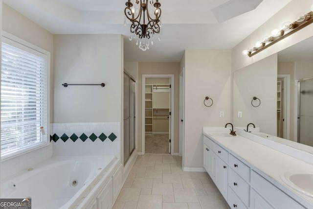 bathroom featuring a wealth of natural light, tile patterned floors, vanity, and independent shower and bath