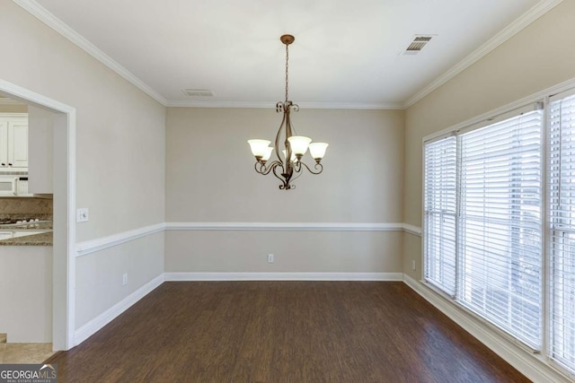 unfurnished dining area with a notable chandelier, crown molding, and dark hardwood / wood-style flooring