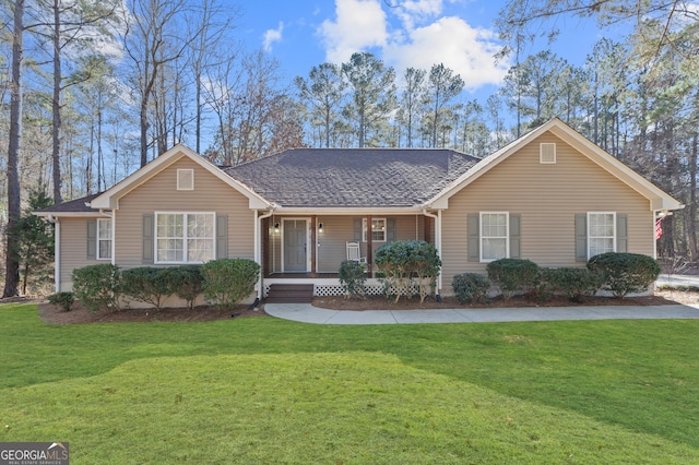 single story home with a front lawn and covered porch