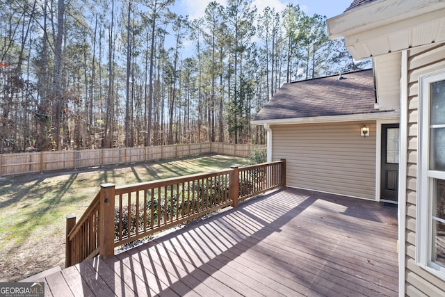 wooden deck with a lawn