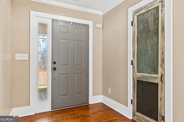 foyer featuring crown molding and hardwood / wood-style flooring