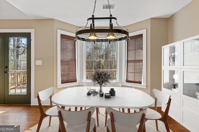 dining room with hardwood / wood-style floors