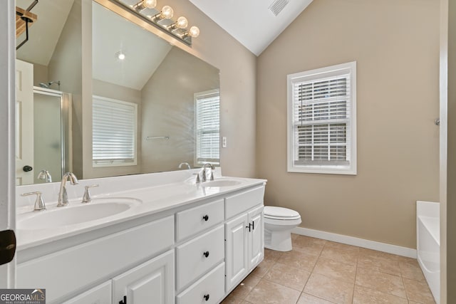 full bathroom featuring toilet, vaulted ceiling, vanity, independent shower and bath, and tile patterned flooring