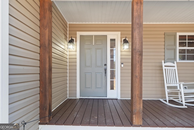 property entrance with covered porch