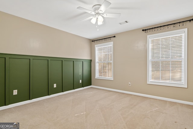 carpeted empty room with ceiling fan