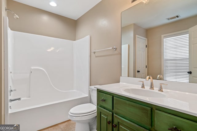 full bathroom featuring vanity, tile patterned floors, shower / bathtub combination, and toilet