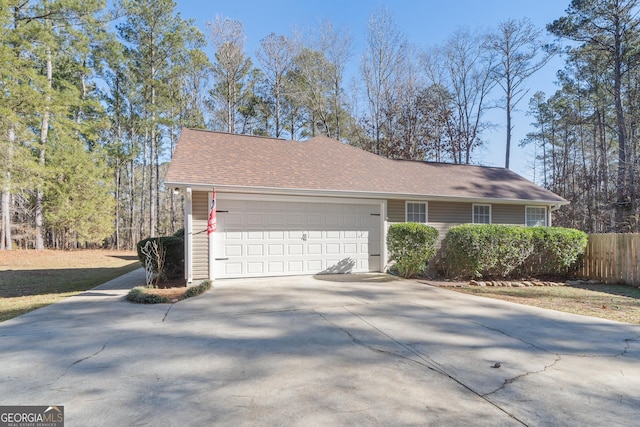 view of side of property with a garage