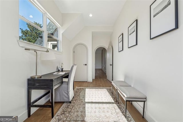 hall with dark wood-type flooring