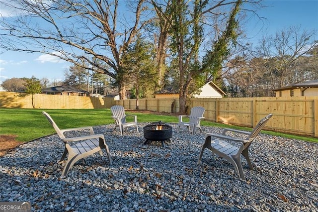 view of yard featuring an outdoor fire pit