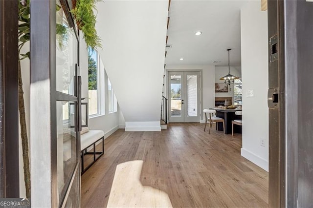 entryway with french doors and light wood-type flooring