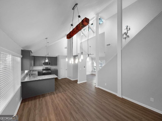 kitchen featuring sink, high vaulted ceiling, kitchen peninsula, and appliances with stainless steel finishes