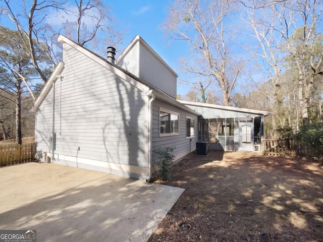 view of side of home with a patio