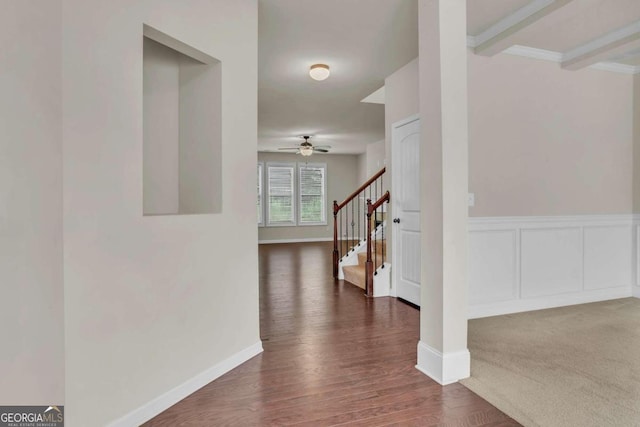 corridor with dark hardwood / wood-style floors and beam ceiling