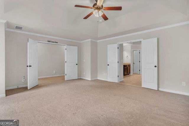 unfurnished bedroom with ceiling fan, light colored carpet, and ornamental molding