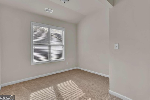 unfurnished room with light colored carpet