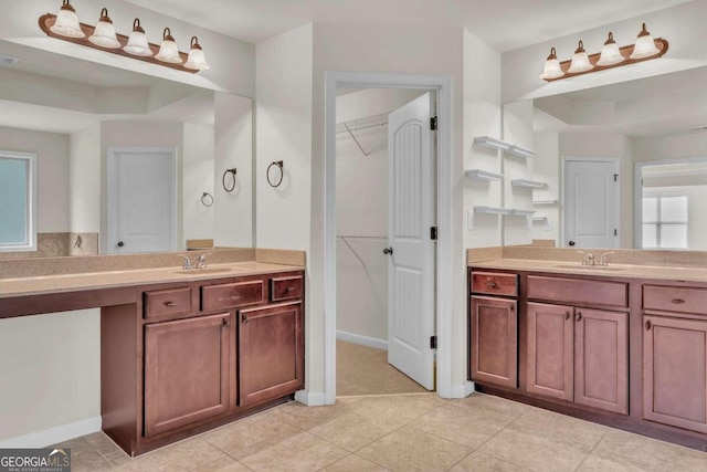 bathroom with tile patterned floors and vanity