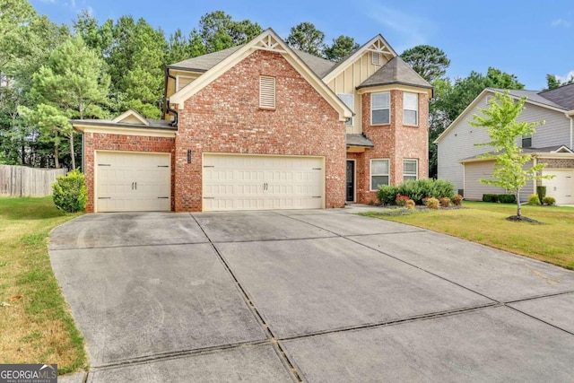 view of property with a front yard and a garage
