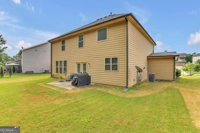 back of house with a patio, central AC unit, and a yard