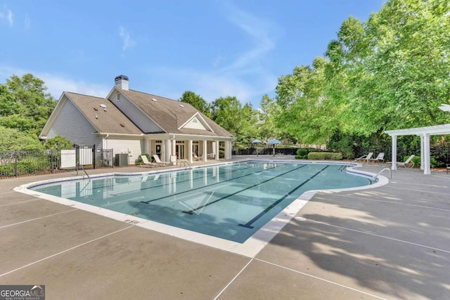 view of swimming pool featuring a patio and a pergola