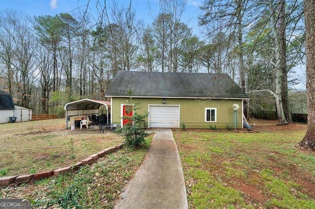 exterior space featuring a front yard and a carport